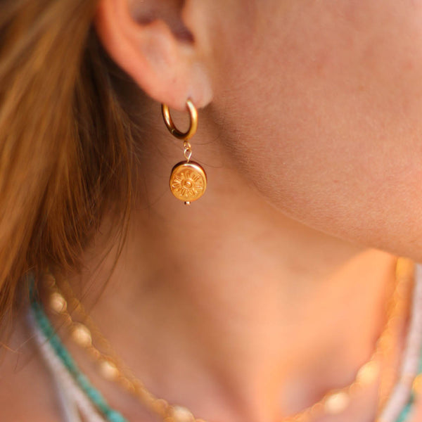 boucles anneau soleil dore acier