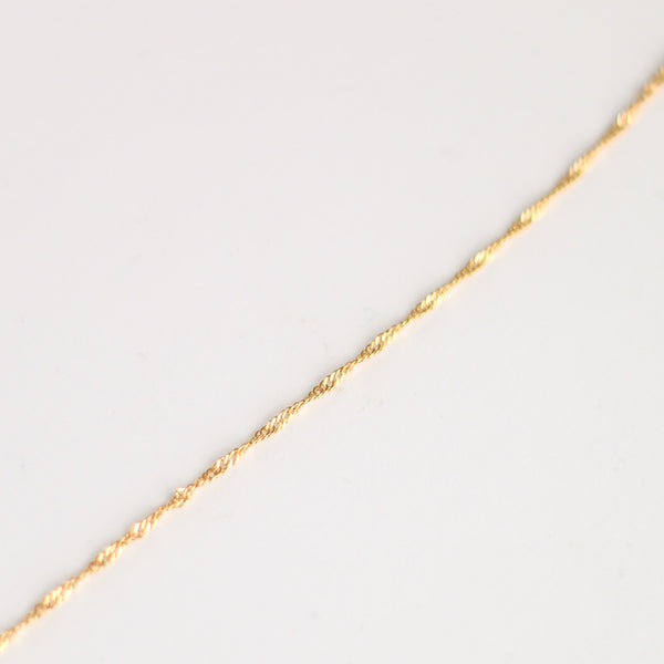collier pierre de soleil doré chaîne torsadée