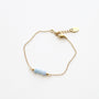 Bracelet en aigue-marine sur chaîne acier inoxydable.