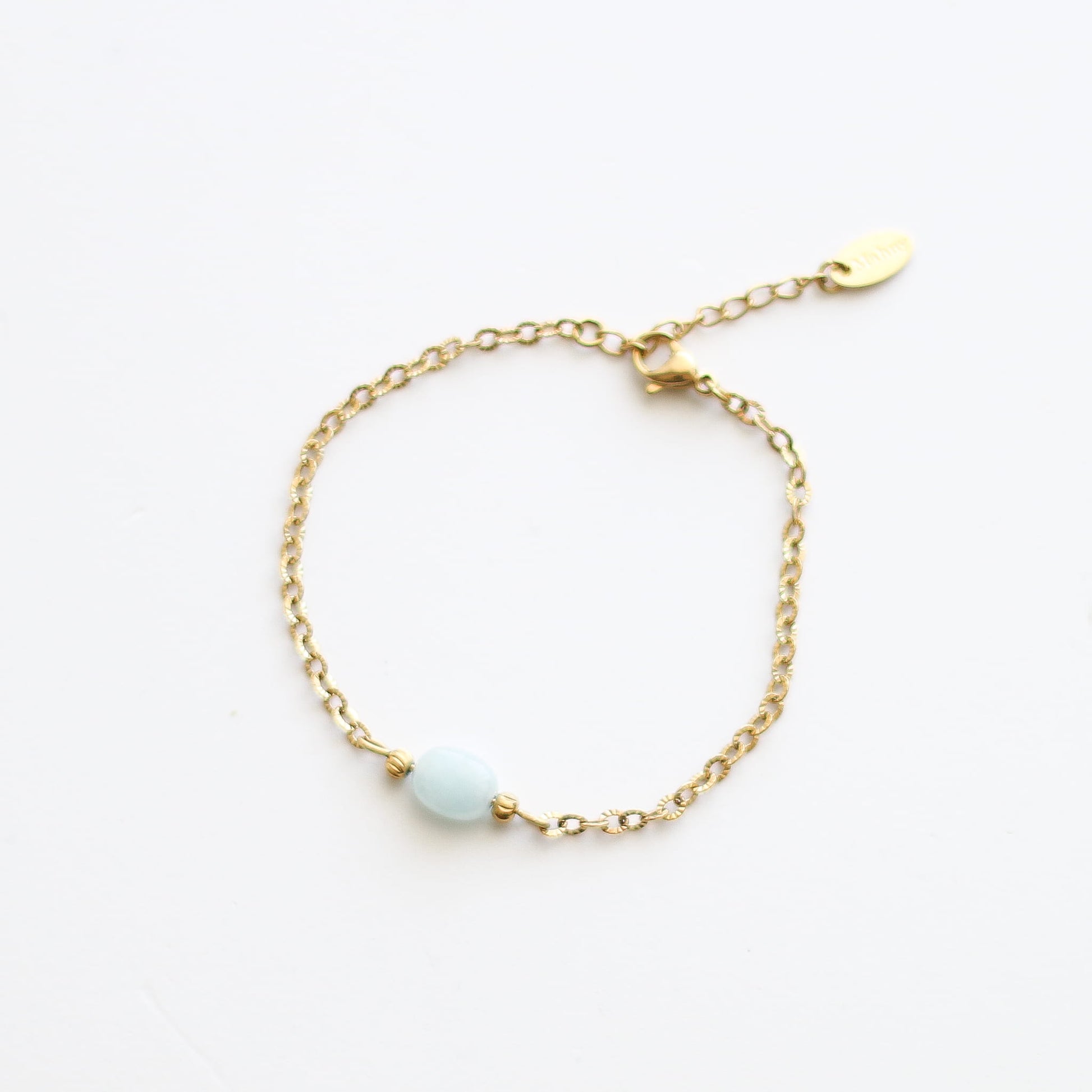 Bracelet en aigue-marine sur chaîne acier inoxydable.