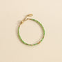 Bracelet perlé en Diopside verte avec des billes dorées