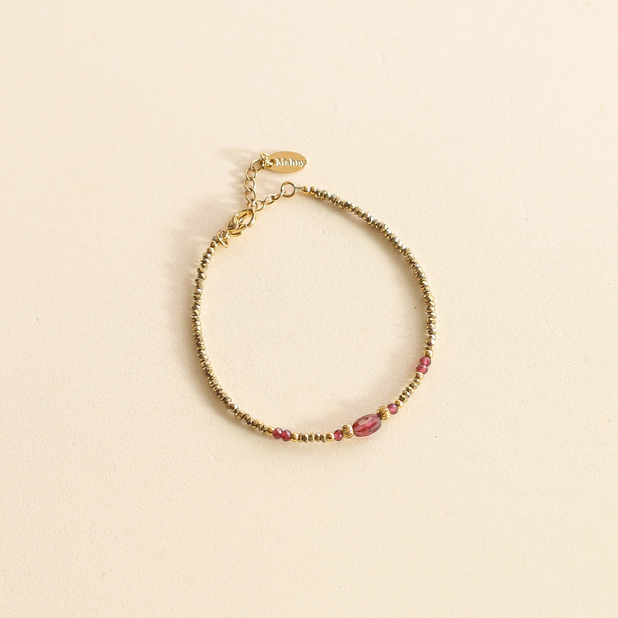 Bracelet en Hématite et Grenat aux tons dorés et rouges