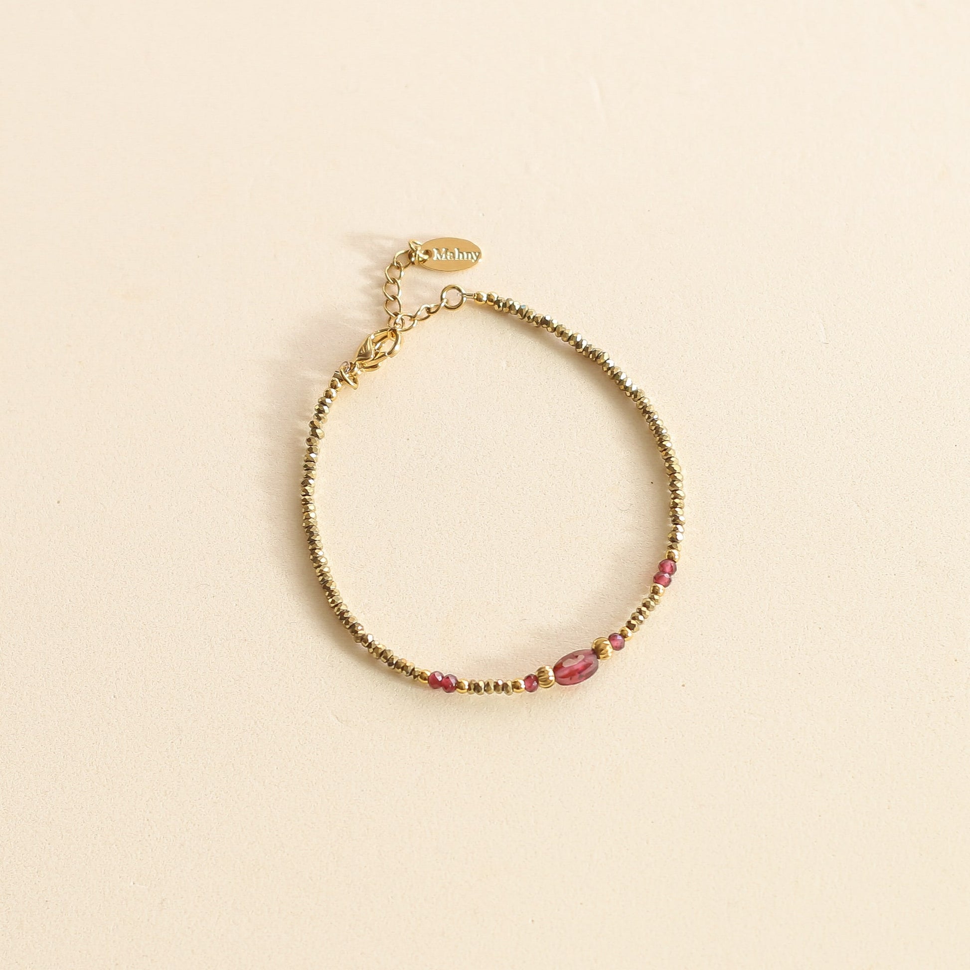 Bracelet en Hématite et Grenat aux tons dorés et rouges