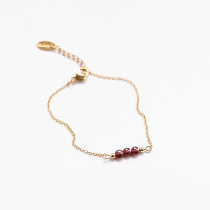 bracelet perle acier grenat doré