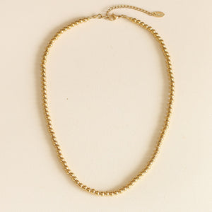 Collier en acier inoxydable avec des boules dorées