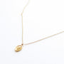 Collier à pendentif médaille doré, acier inoxydable.