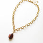 Collier Œil de Taureau, vue à plat, Mahny pierres assemblées main, Paris.