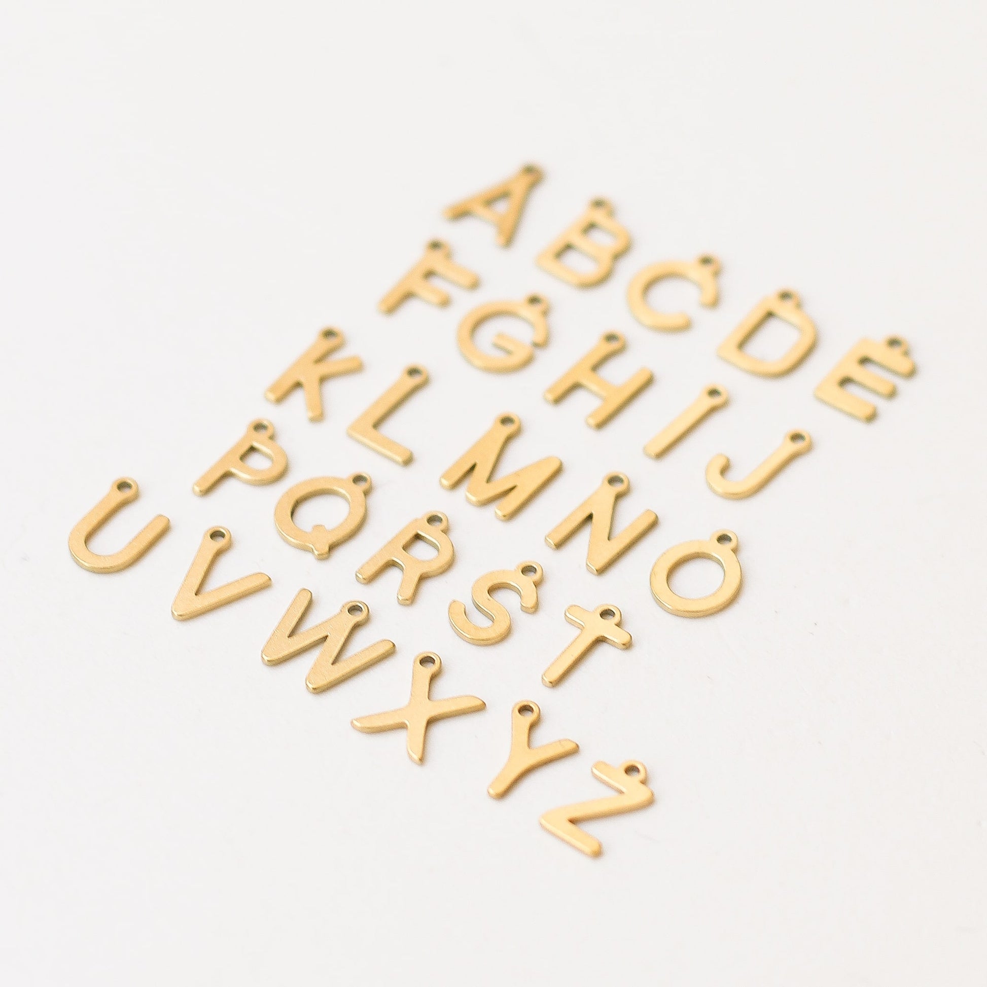 pendentif lettre acier inoxydable créatrice